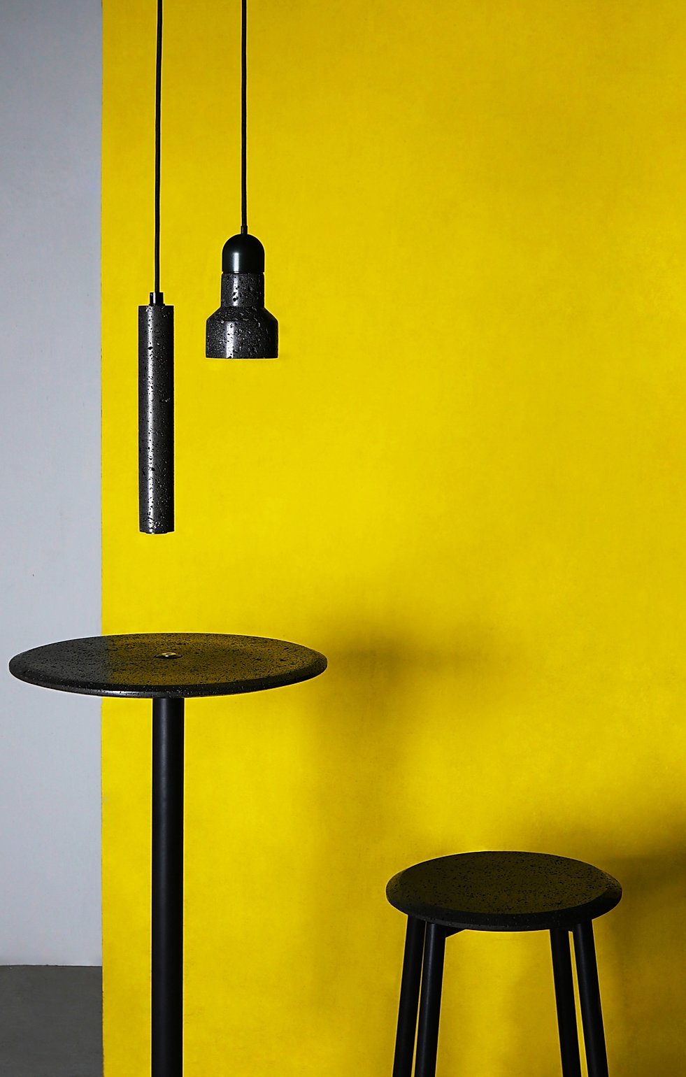 chair table lights by yellow wall